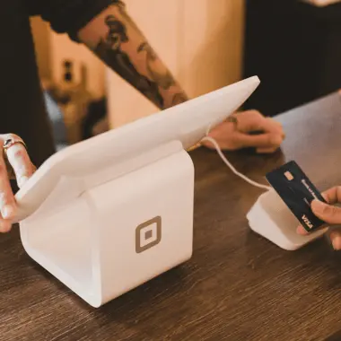 Customer paying by card at a point-of-sale terminal